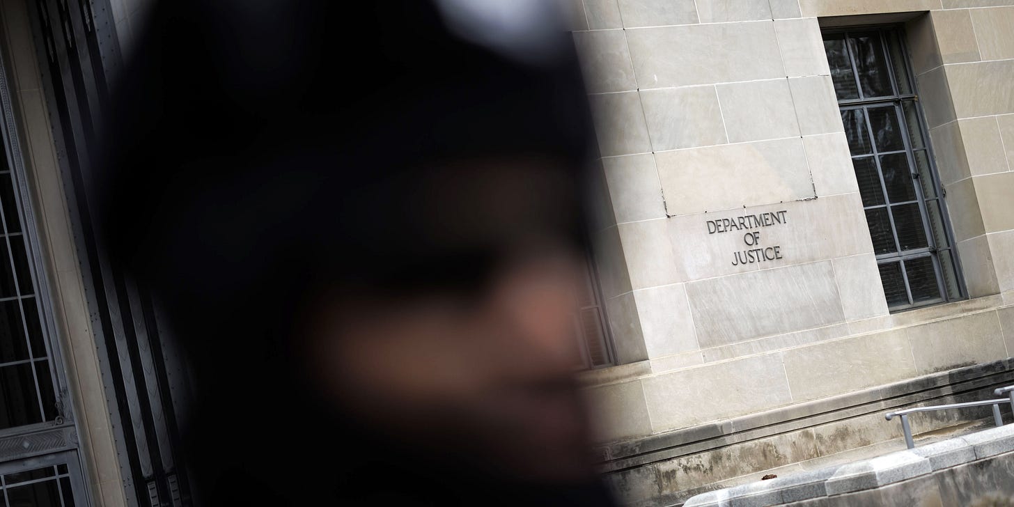 The US Department of Justice (DOJ) headquarters in Washington, DC, US, on Friday, Feb. 17, 2023. The Justice Department is shifting its corruption probe of the Texas attorney general from federal prosecutors in the state to investigators in Washington, according to a person familiar with the matter. Photographer: Ting Shen/Bloomberg via Getty Images