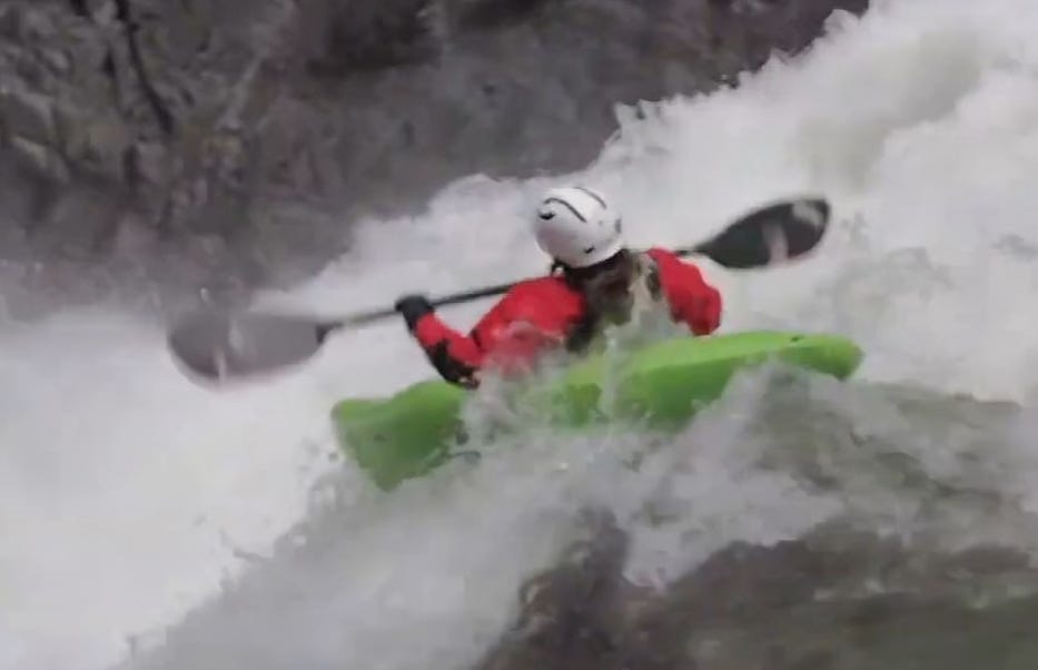 A thrilling kayaking adventure navigating through exciting whitewater rapids.