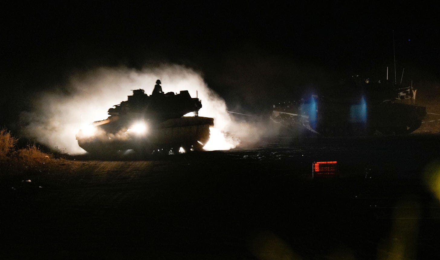 2Y7M73N An Israeli tank manoeuvres in northern Israel near the Israel-Lebanon border, Monday, Sept. 30, 2024. (AP Photo/Baz Ratner)