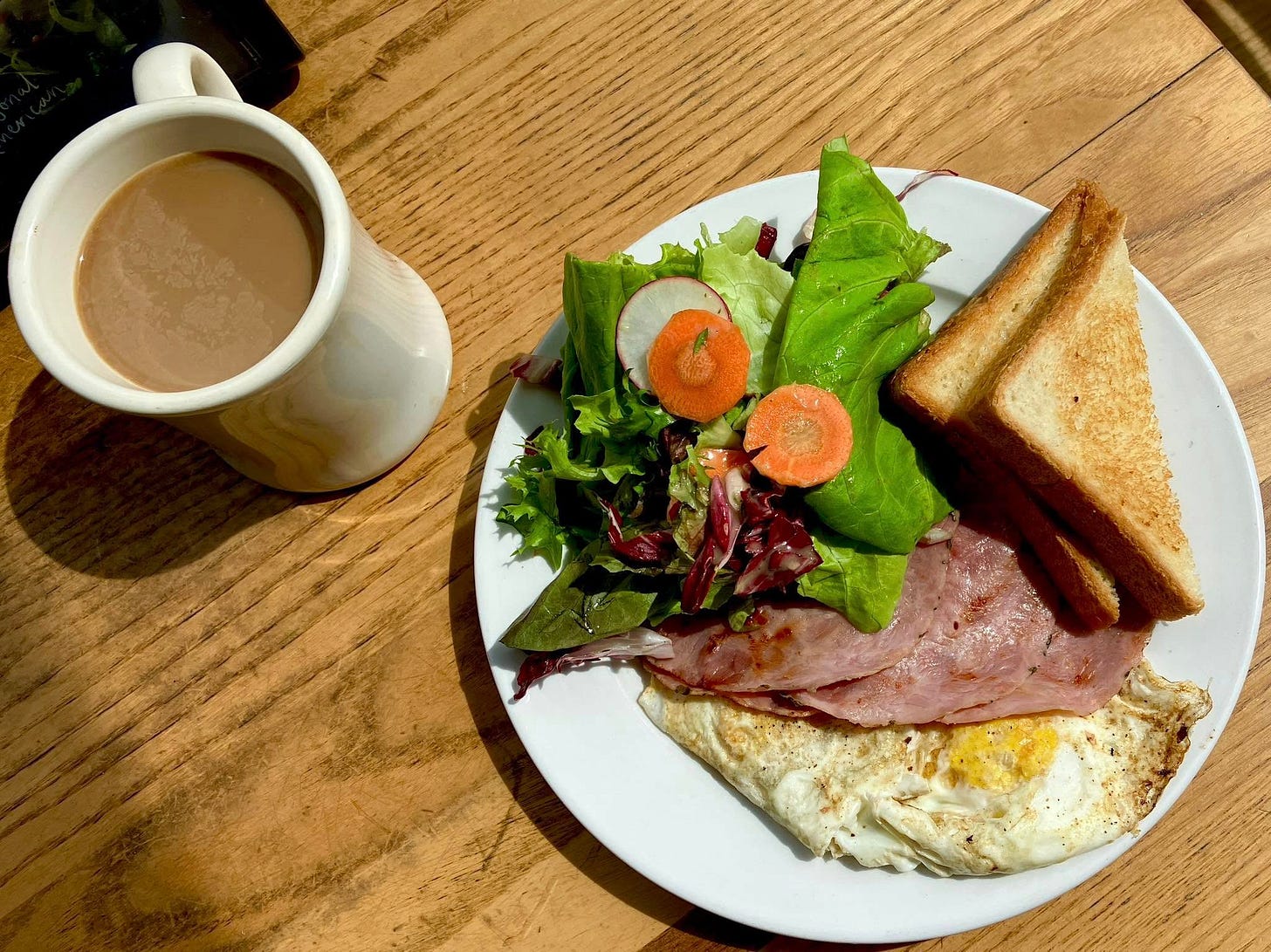 May be an image of omelet and club sandwich