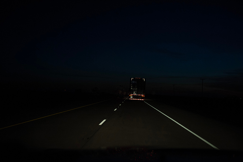 night driving behind semi truck in Nevada by Paul Vlachos