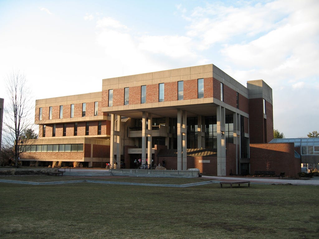 A brick and stone building with multiple levels and columns