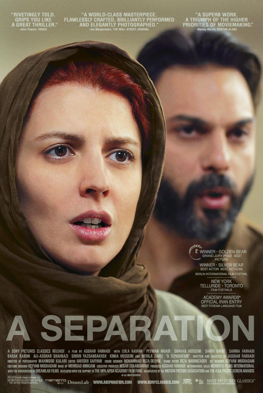 A red haired woman on left and a man blurred in the background on the right look off-right