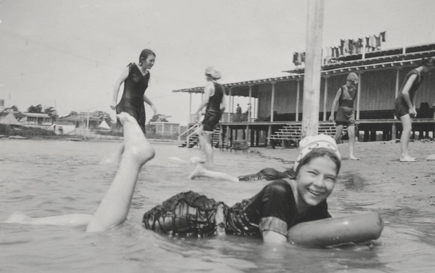 young girl playing in a shallow pool young girl playing in a shallow pool