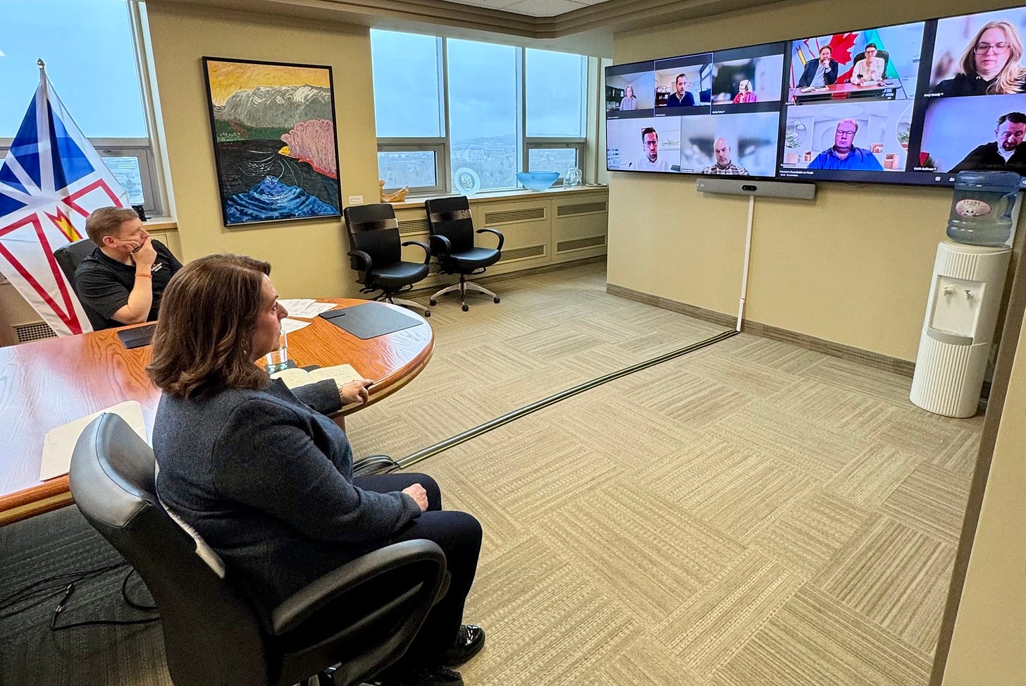 May be an image of 5 people, people studying, television, newsroom and text