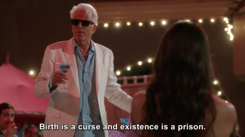 Michael from the Good Place wearing sunglasses and a white suit and holding a cocktail, saying "Birth is a curse and existence is a prison"