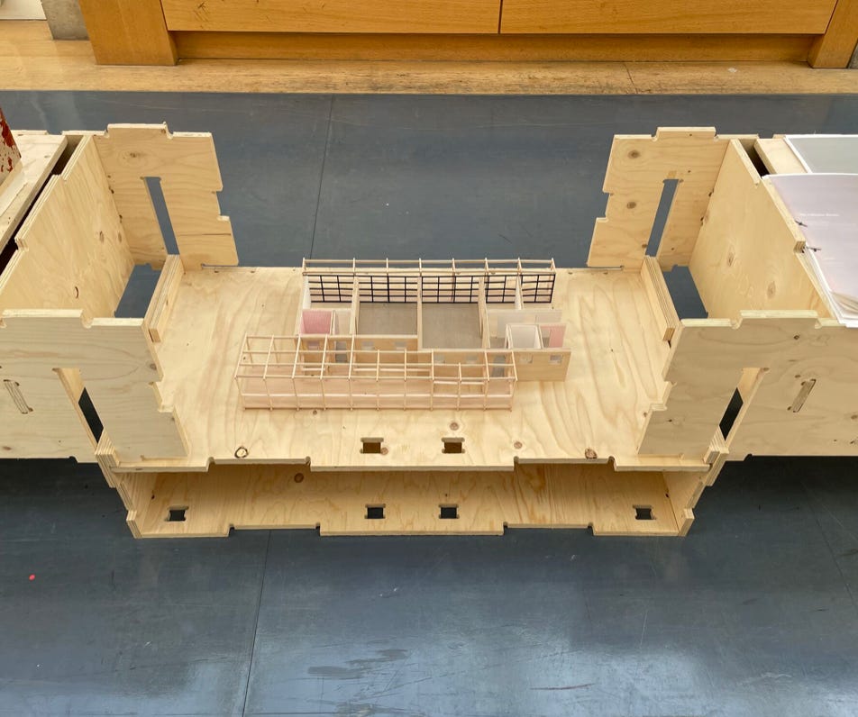 A deconstructed WikiHouse Skylark block used as an display plinth, showing an architectural model placed inside the block.