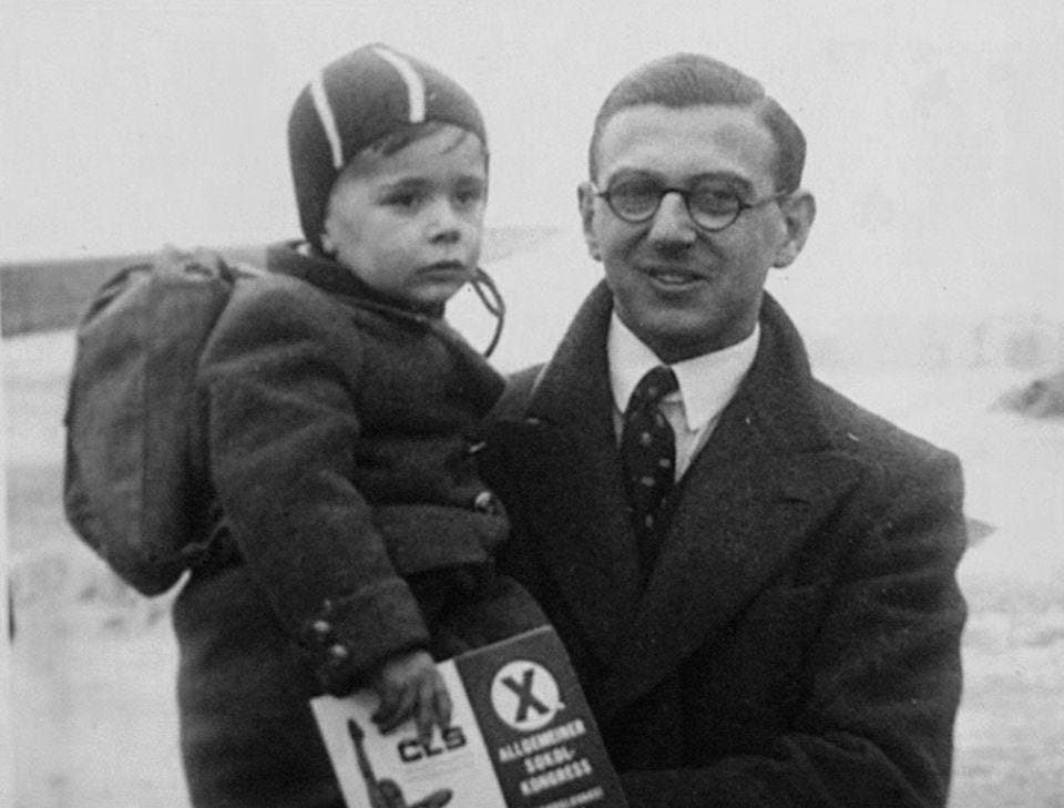 Nicholas Winton with one of the children he helped rescue from Czechoslovakia in the run-up to and start of the Second World War, as depicted in a photograph from the scrapbook of he kept.