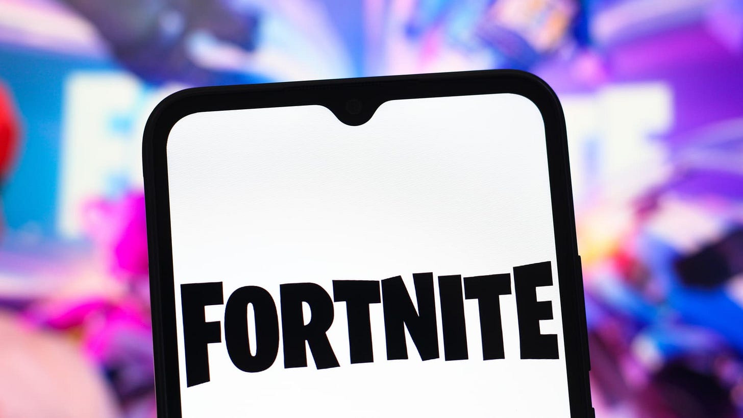 In this photo illustration, the Fortnite logo is seen displayed on a smartphone screen.