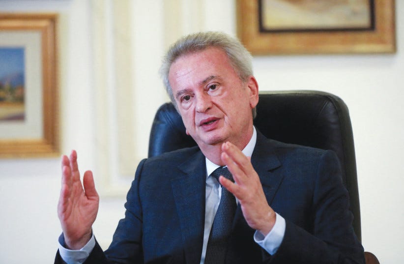  LEBANON’S CENTRAL Bank Governor Riad Salameh speaks during an interview, in Beirut, in 2021. Salameh is accused of embezzling bank assets, money laundering and mismanaging public funds. (photo credit: MOHAMED AZAKIR/REUTERS)