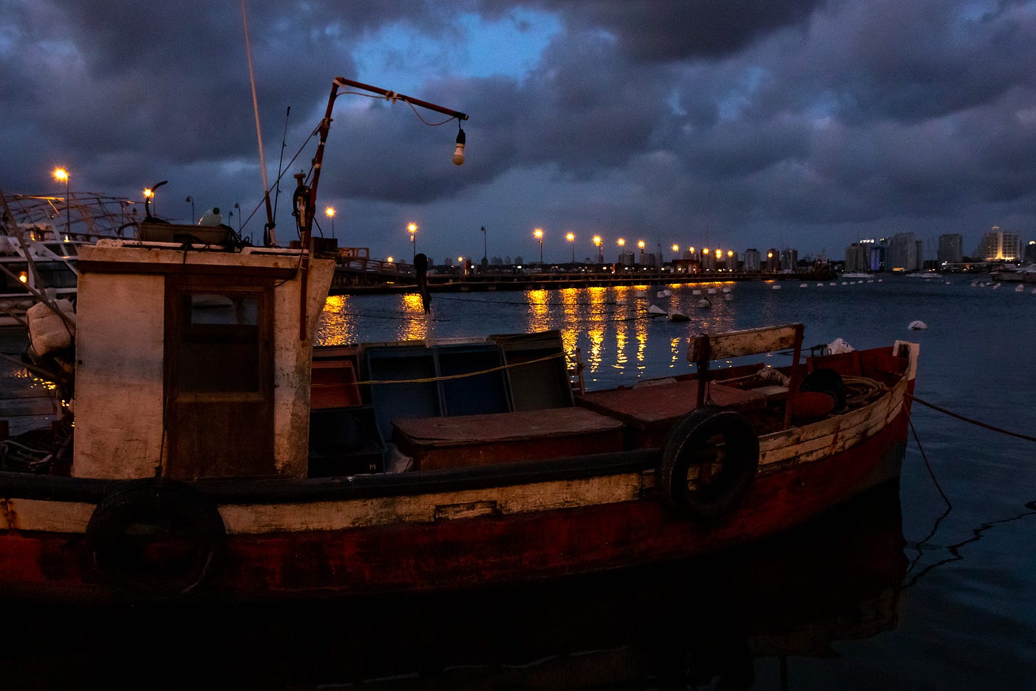 a boat at the port on a cloudy night