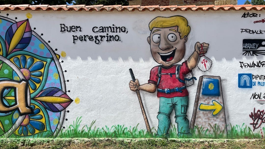 a painted happy guy on a wall in Spain