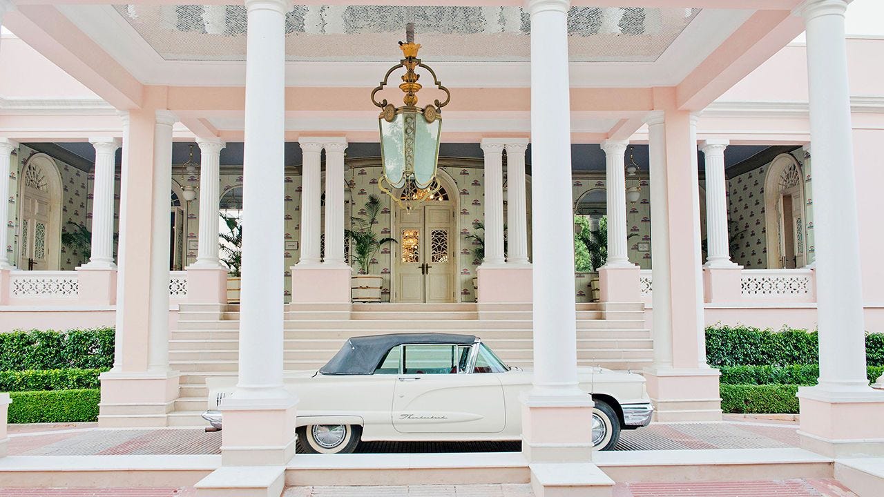 A white Bentley car parked outside the Raj Mahal Boutique Hotel,  Jaipur, India