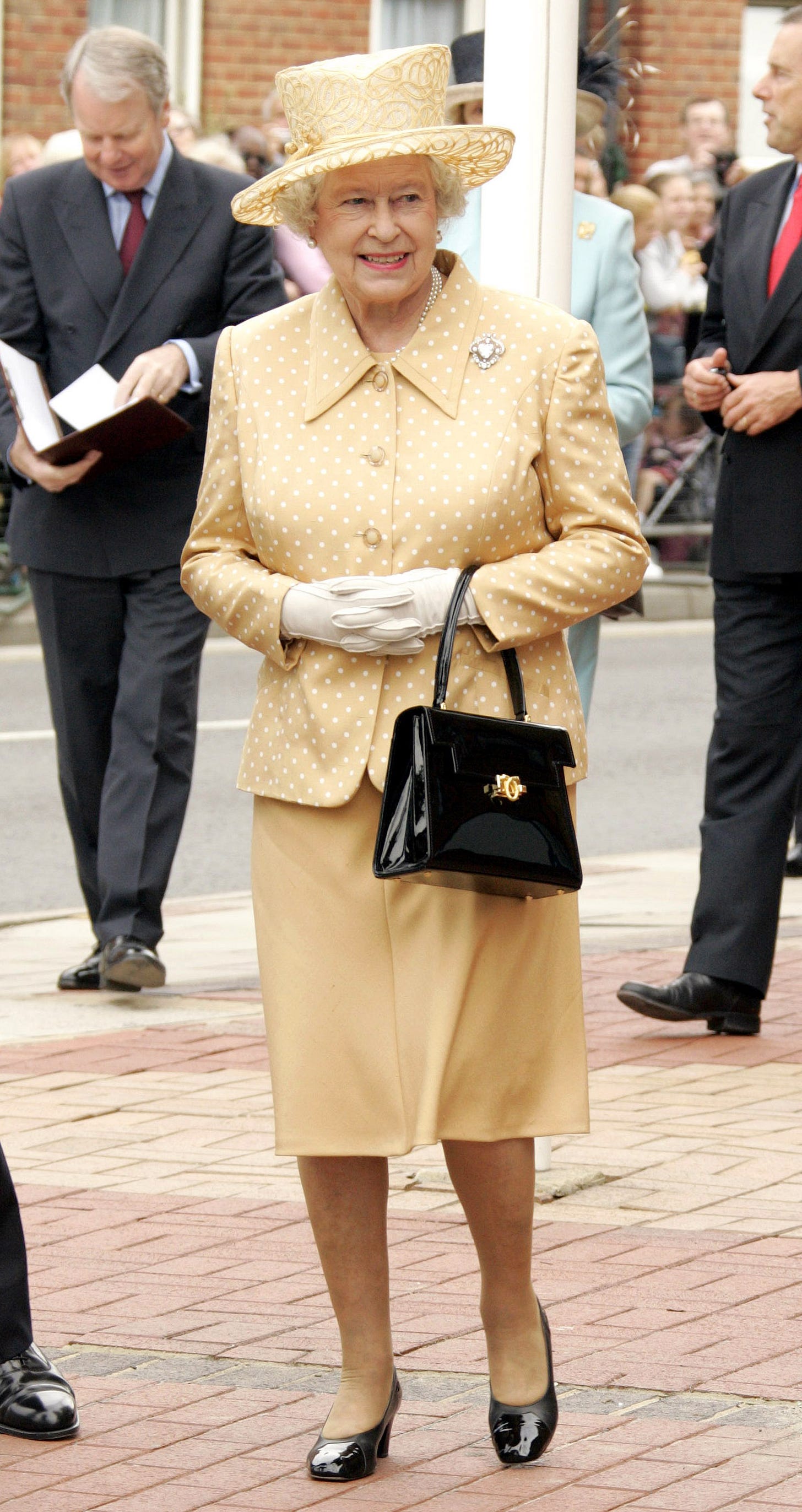 Queen Elizabeth wearing lemon polka dot dress