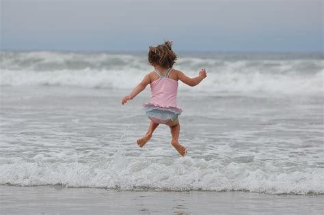 Free Images : beach, sea, coast, sand, girl, play, shore, vacation ...