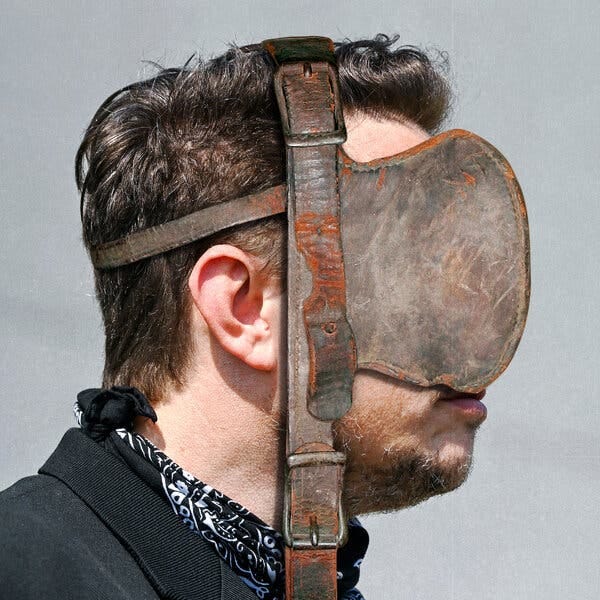 An illustration of Elon Musk in profile. A horse blinder is strapped to his head so that he can only look straight ahead. 