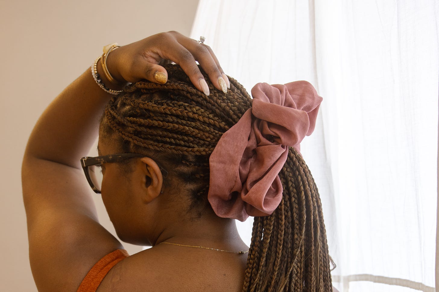 Picture of a Black woman with her hair in braids