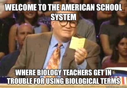 Drew Carry, holding up a notecard, captioned "Welcome to the American School system, where biology teachers get in trouble for using biological terms"