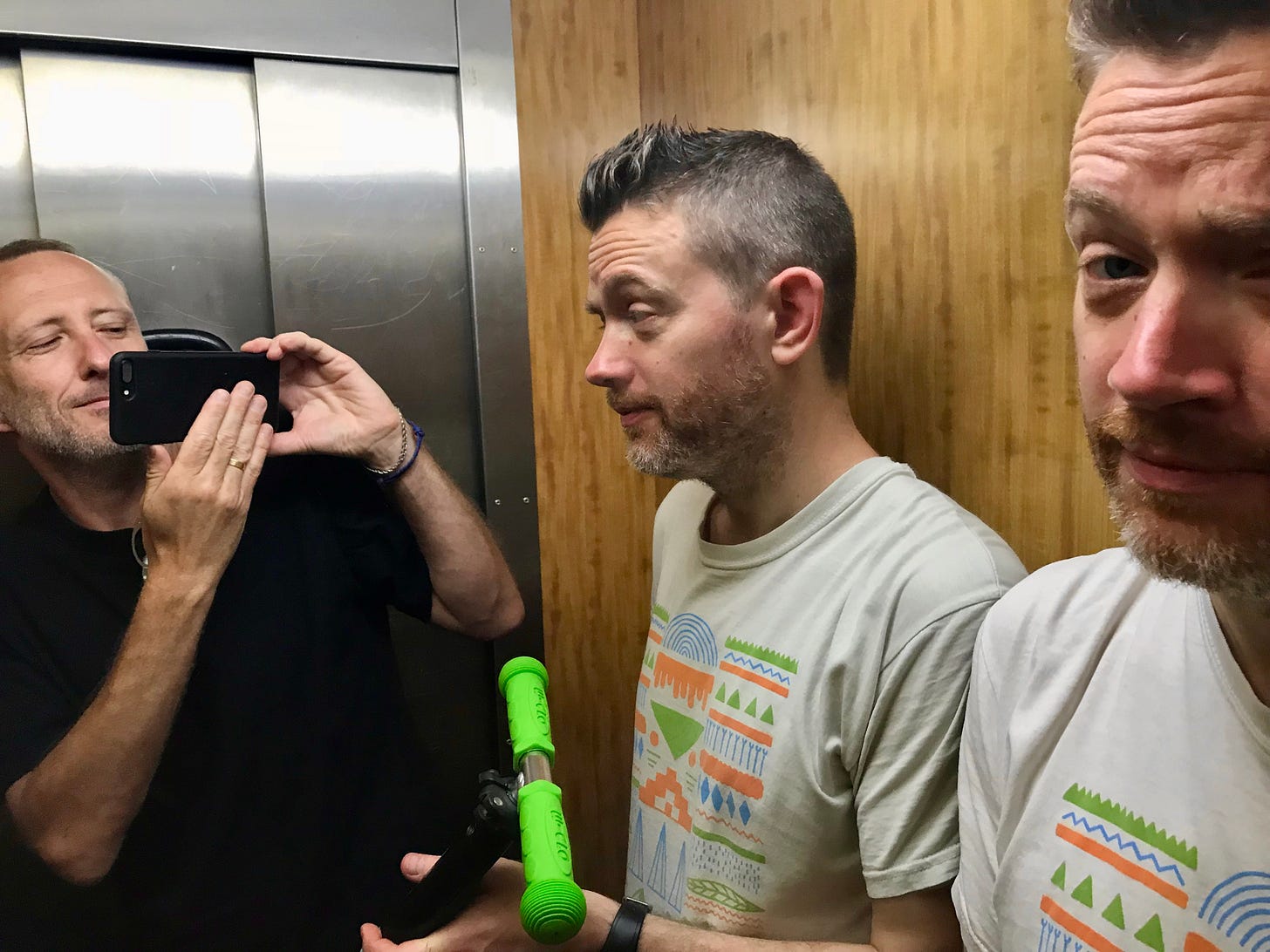 Two podcasters in a lift