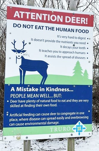 Sign saying 'Attention Deer! Do not eat the human food'