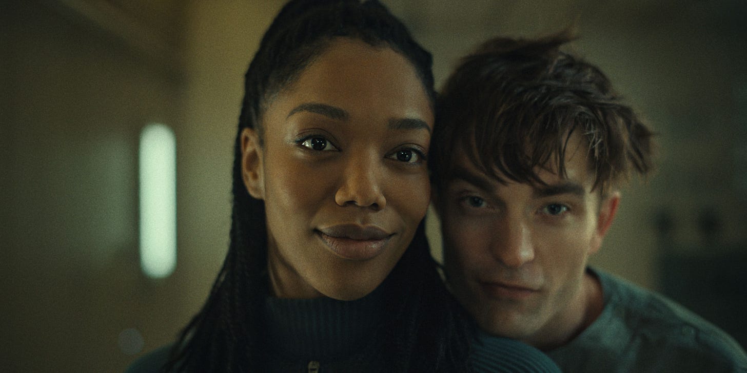 Robert Pattinson's Romance Storyline In Mickey 17 Explained By Love  Interest Naomi Ackie: "[It's] About Defending The Underdog"
