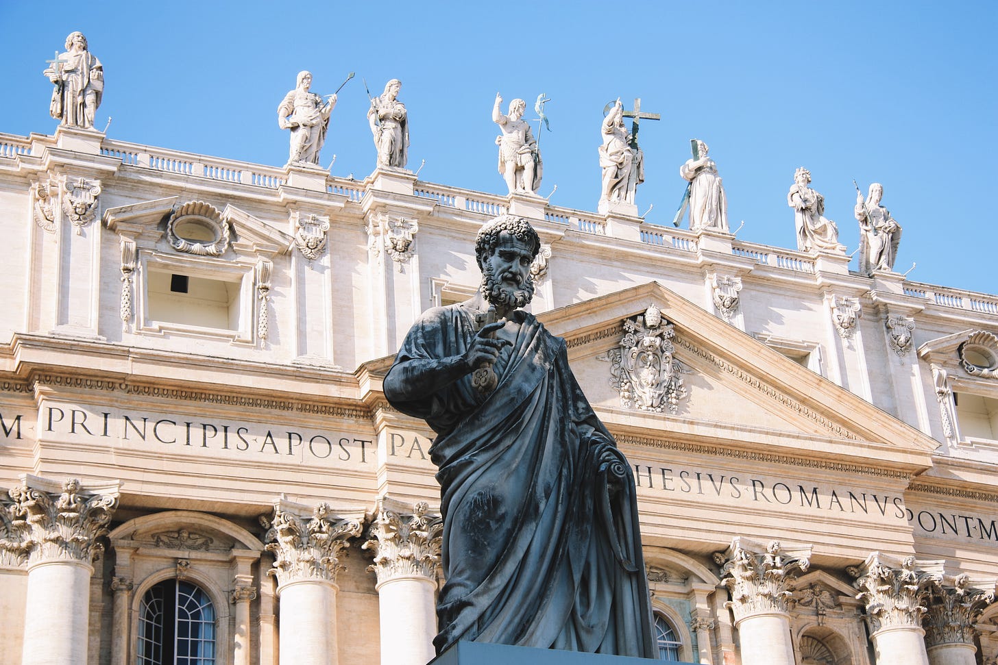 Sculpture of St. Peter in front of St. Peter's Basilica in Rome.