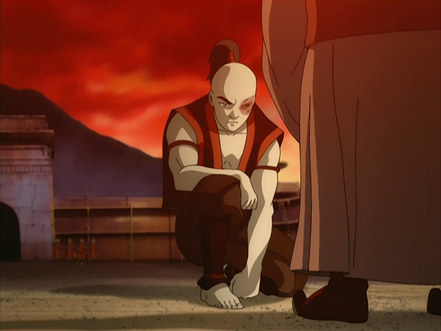 Zuko kneels before Iroh, about to face Zhao in an Agni Kai.
