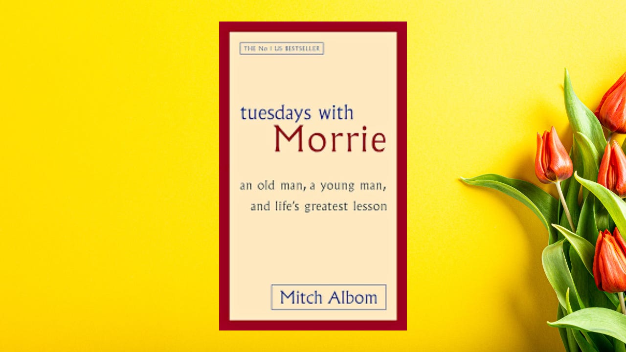 The cover of "Tuesday with Morrie" in front of a yellow background next to orange tulips.
