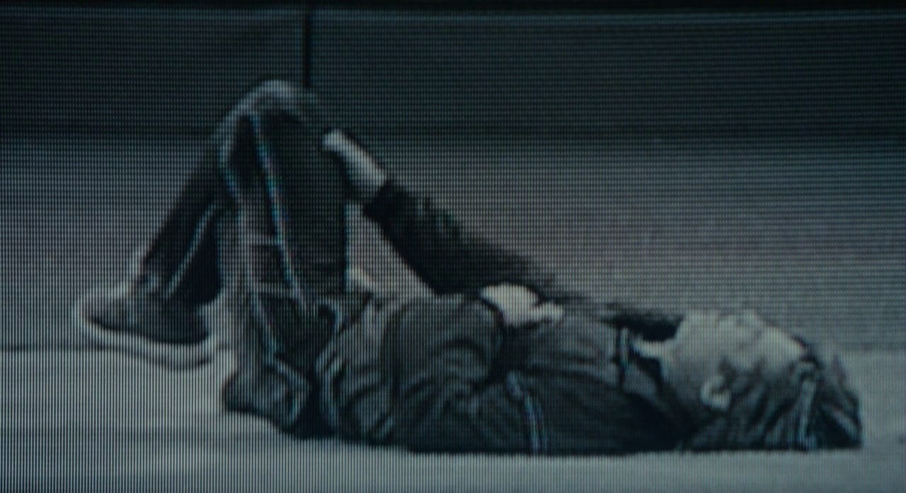A person lying on the ground

Description automatically generated