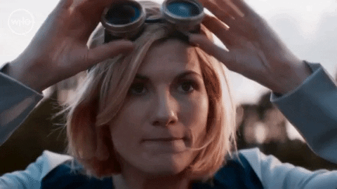Jodie Whitaker as Doctor Who has a determined face and puts on goggles