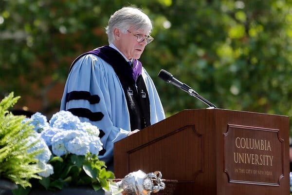 Lee C. Bollinger, wearing a blue academic robe, speaks during a graduation ceremony at Columbia University in 2017.