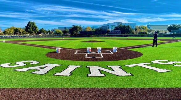 behind home plate with saints written on turf