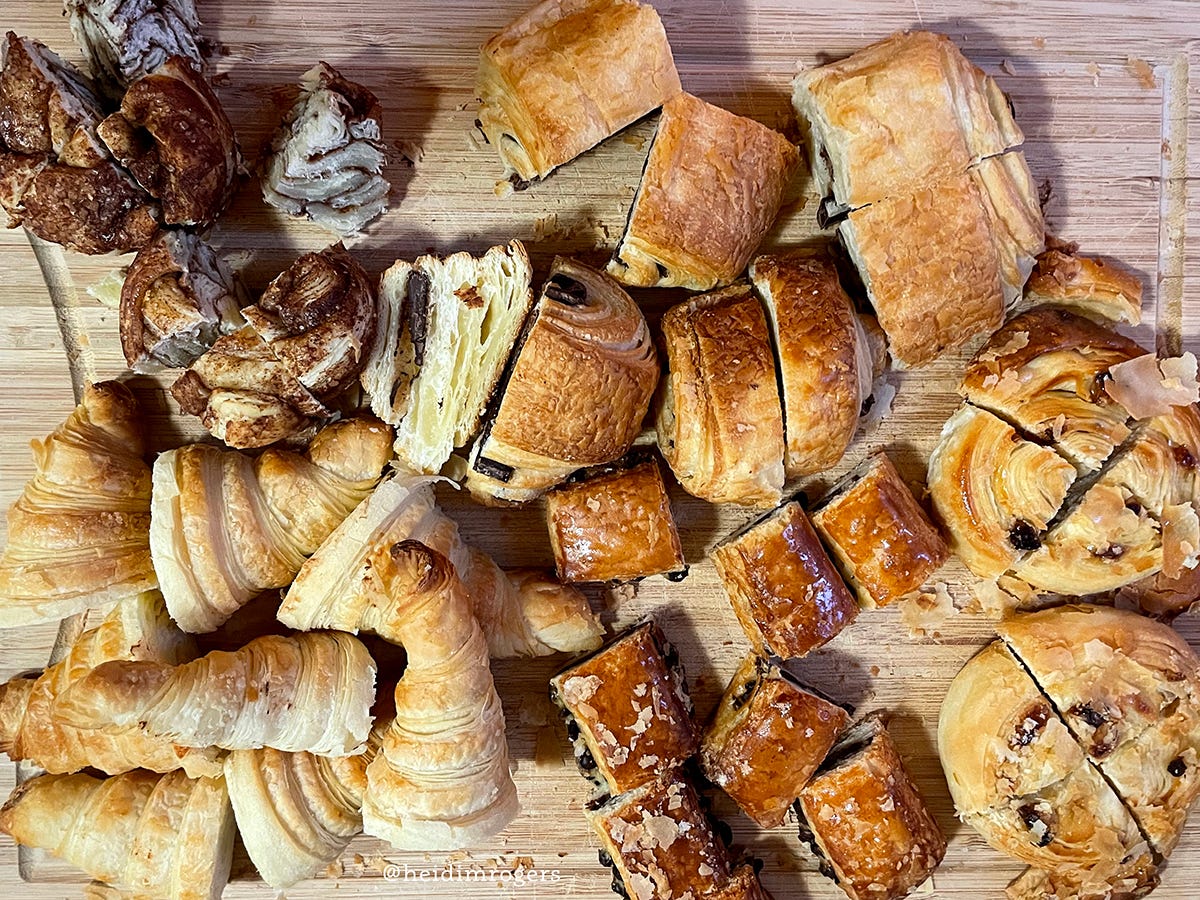 Flat lay of a variety of croissants on a cutting board