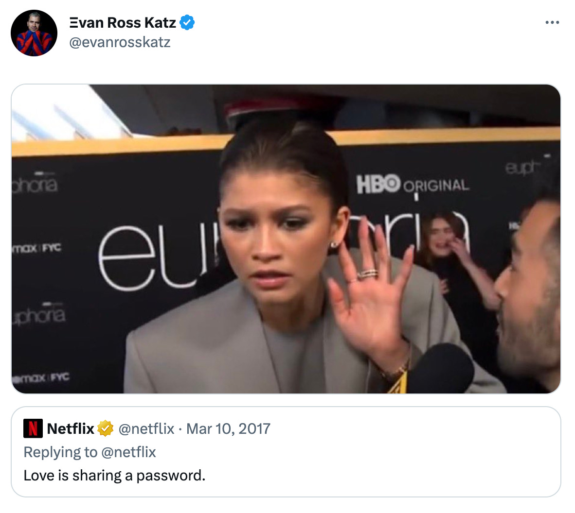 tweet from evan ross katz @evanrosskatz of an image of zendaya on the red carpet with her hand behind her ear to listen better, quote tweeting a 2017 tweet from netflix that says "love is sharing a password"