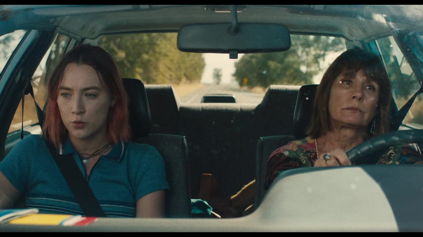 Still from Lady Bird: Lady Bird and her mom sit in the car, listening to a book on tape.