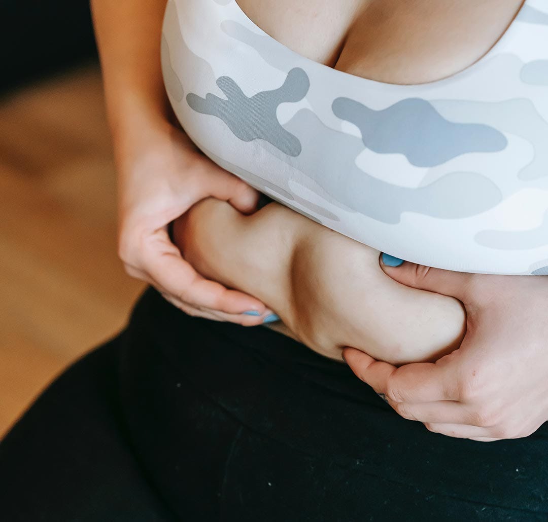 Woman Squeezing Stomach Body Acceptance