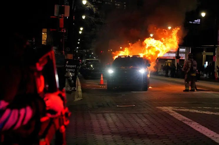 An Atlanta police car is engulfed in flames after protests took to the streets on Saturday, Jan 21 in the wake of activists Manuel Teran's death.
