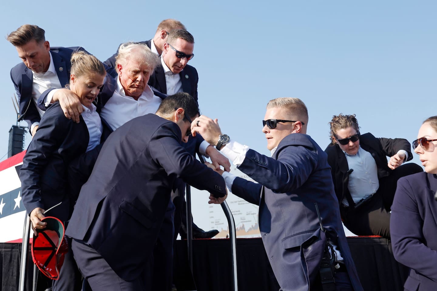 Republican presidential candidate and former President Donald Trump is rushed off stage. Photo / Getty Images Republican presidential candidate and former President Donald Trump is rushed off stage. Photo / Getty Images