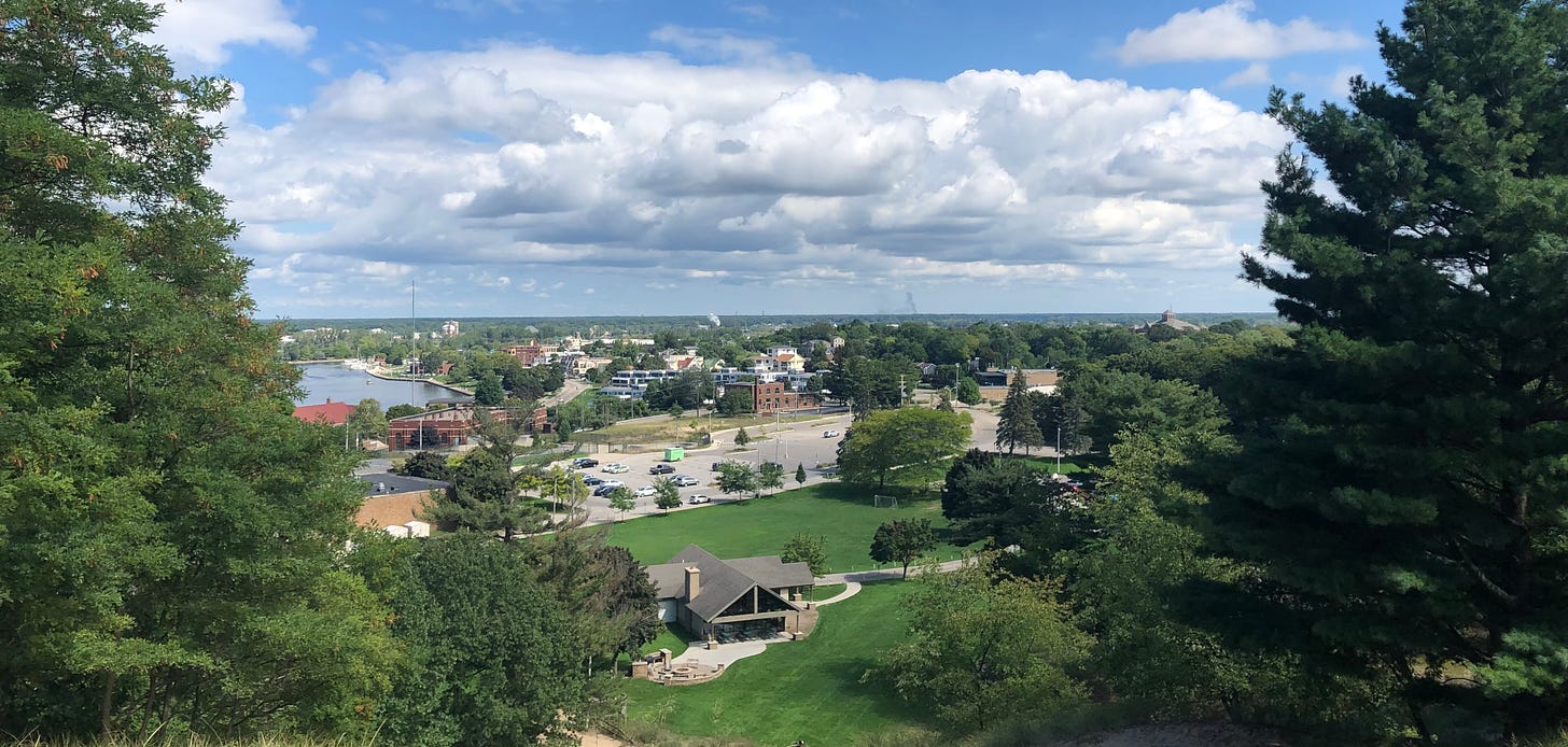 A photo from a lookout area of a town on Lake Michigan
