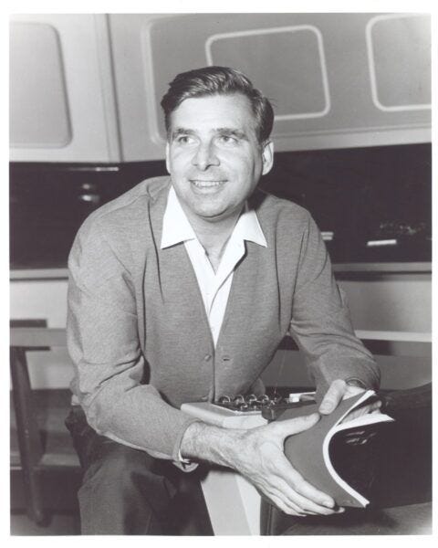 Gene Roddenberry sitting with new Star Trek Movie show script 2021