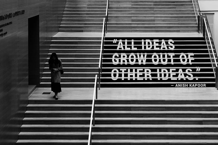 Stairs, with the words, “ALL IDEAS GROW OUT OF OTHER IDEAS”.