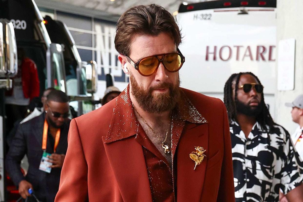 Travis Kelce Flaunts His Chest Hair in '70s-Inspired Suit with Massive Gold  Brooch and Aviators: 'Sunday Night Fever!'