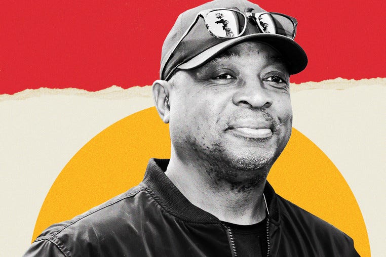 A photo illustration shows a torn paper background with a photo of Chuck D.