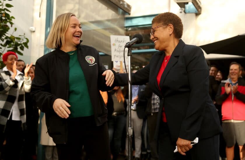 VENICE, CA - JANUARY 13, 2023 - - Los Angeles City Council Member Traci Park, left, and Los Angeles Mayor Karen Bass enjoy a light moment at a thank you reception for overseeing efforts to move 96 homeless into temporary housing at the Rose Cafe in Venice on January 13, 2023. Bass' Inside Safe initiative has moved scores of homeless people indoors over the past few weeks. (Genaro Molina / Los Angeles Times)