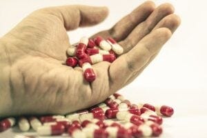 A hand with pills in the palm