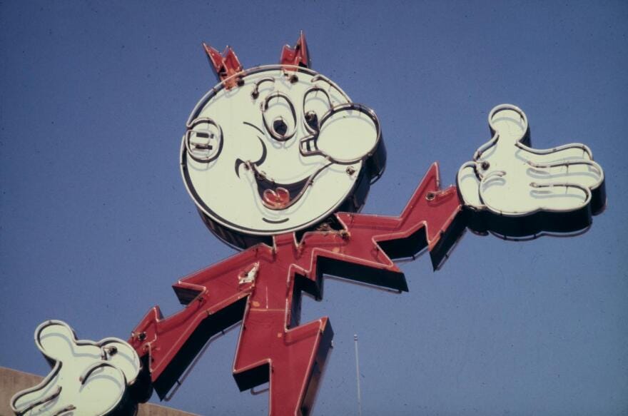 A sign depicting Reddy Kilowatt, the mascot for Houston Lighting & Power, in the 1970s.