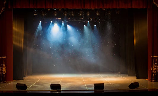 The Stage Of The Theater Illuminated By Spotlights And Smoke From The ...