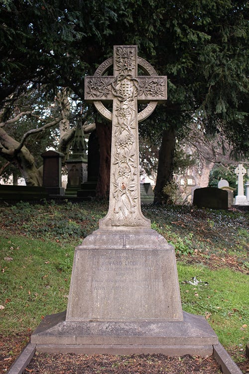 A Celtic Cross monument in a cemetery.