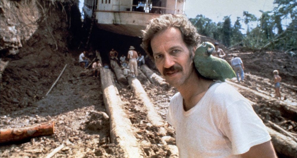 Werner Herzog on the set of Fitzcarraldo with a parrot on his shoulder