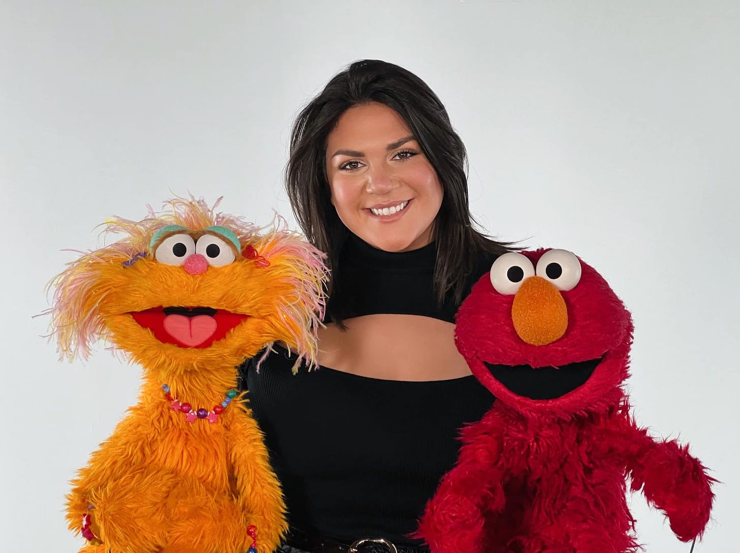 Photo of Christina Vittas with two puppets